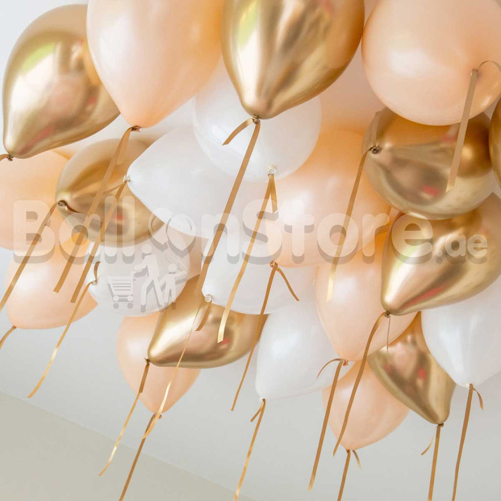 Gold and store white balloons