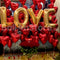 Golden L-O-V-E and  Red Heart Foil and Red Roses Flower & Balloons Arrangement
