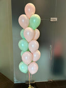 cluster of pastel balloons in light pink and mint green